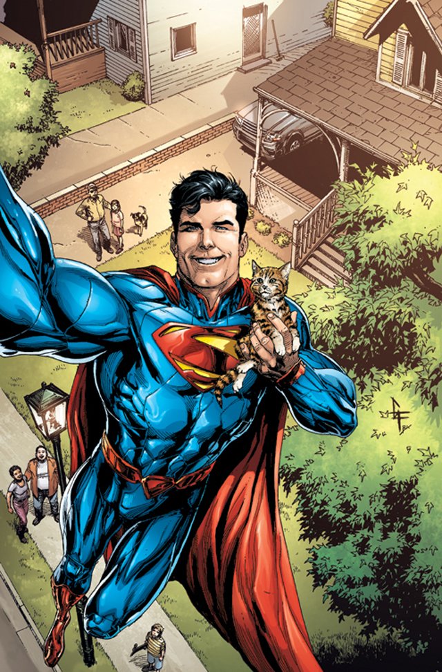 Superman, from DC Comics' The New 52, joyfully holds a kitten while flying above a neighborhood, showcasing a lighthearted moment in this vibrant comic scene.
