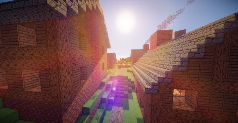 Sunlit village scene in the video game Minecraft, showcasing blocky houses and a pathway with vivid lighting effects.