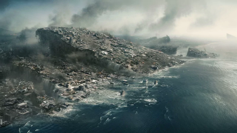 A coastal city faces catastrophic flooding and destruction in a dramatic scene from the 2012 disaster movie.