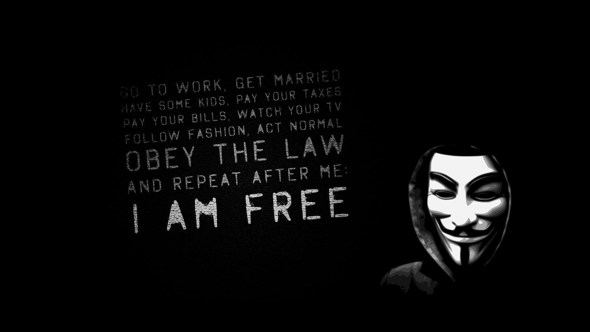 Dark, tech-themed image showing an Anonymous Guy Fawkes mask at right with stencil protest text OBEY THE LAW ... I AM FREE on the left.