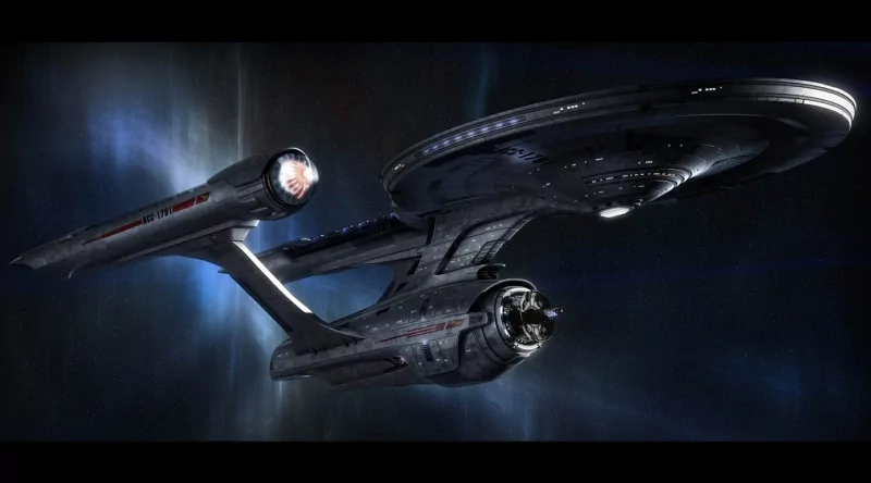 Sci-fi image of the Star Trek USS Enterprise spacecraft glowing against a dark space background.