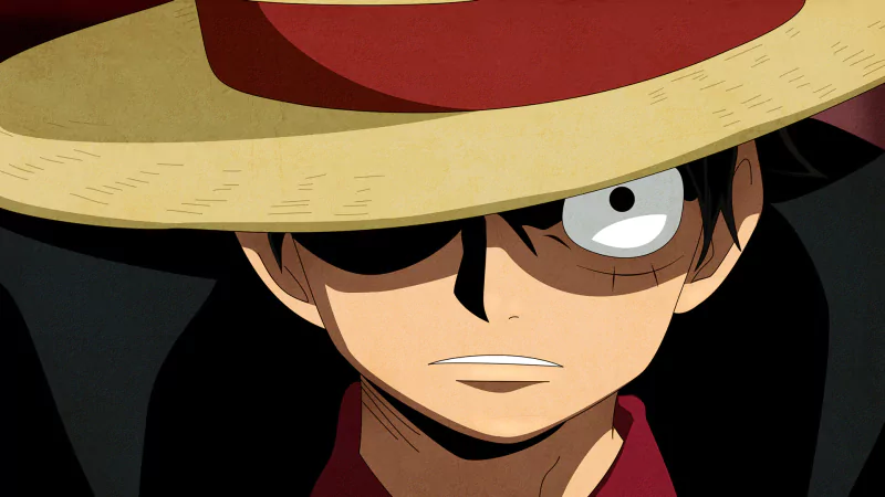 A close-up of Monkey D. Luffy from the anime One Piece, wearing a wide-brimmed straw hat, displaying a determined expression with one eye visible and a scar on his cheek.