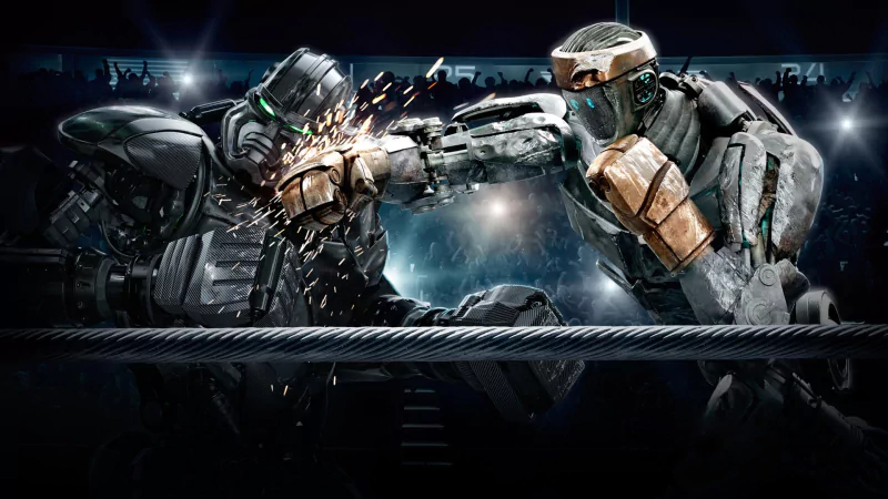 Two battling robots engage in a fierce boxing match inside a ring, showcasing a scene from the movie Real Steel.
