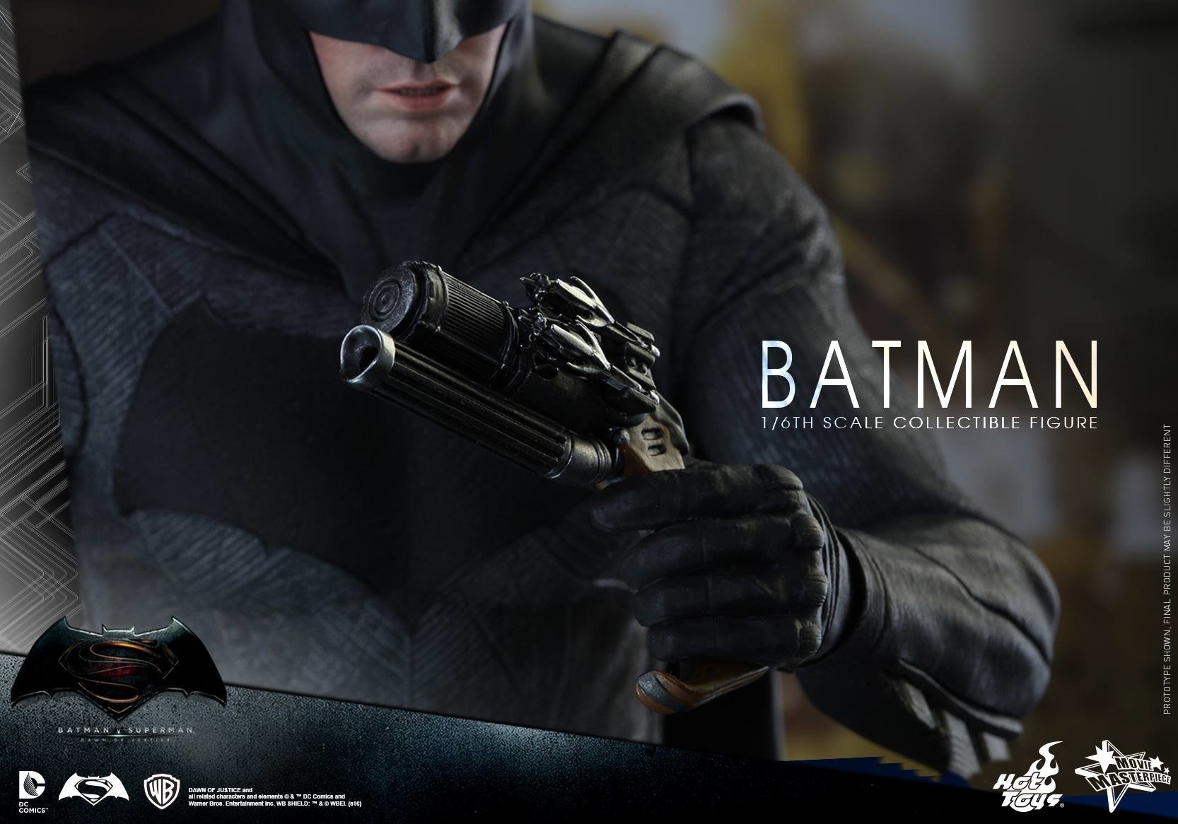 Close-up of Batman in tactical suit holding a gadget, from the movie Batman V Superman: Dawn Of Justice, showcased as a 1/6th scale collectible figure.