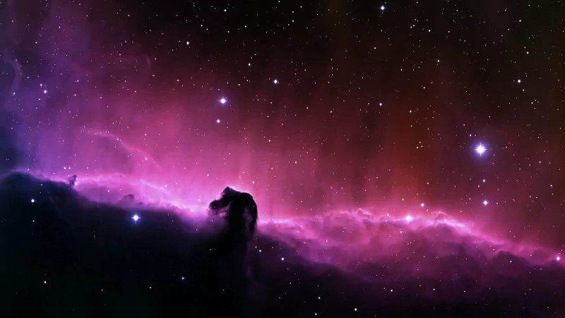 A stunning view of the Horsehead Nebula, showcasing vibrant pink hues against a backdrop of stars, embodying the beauty of galaxies in a Sci-Fi inspired scene.