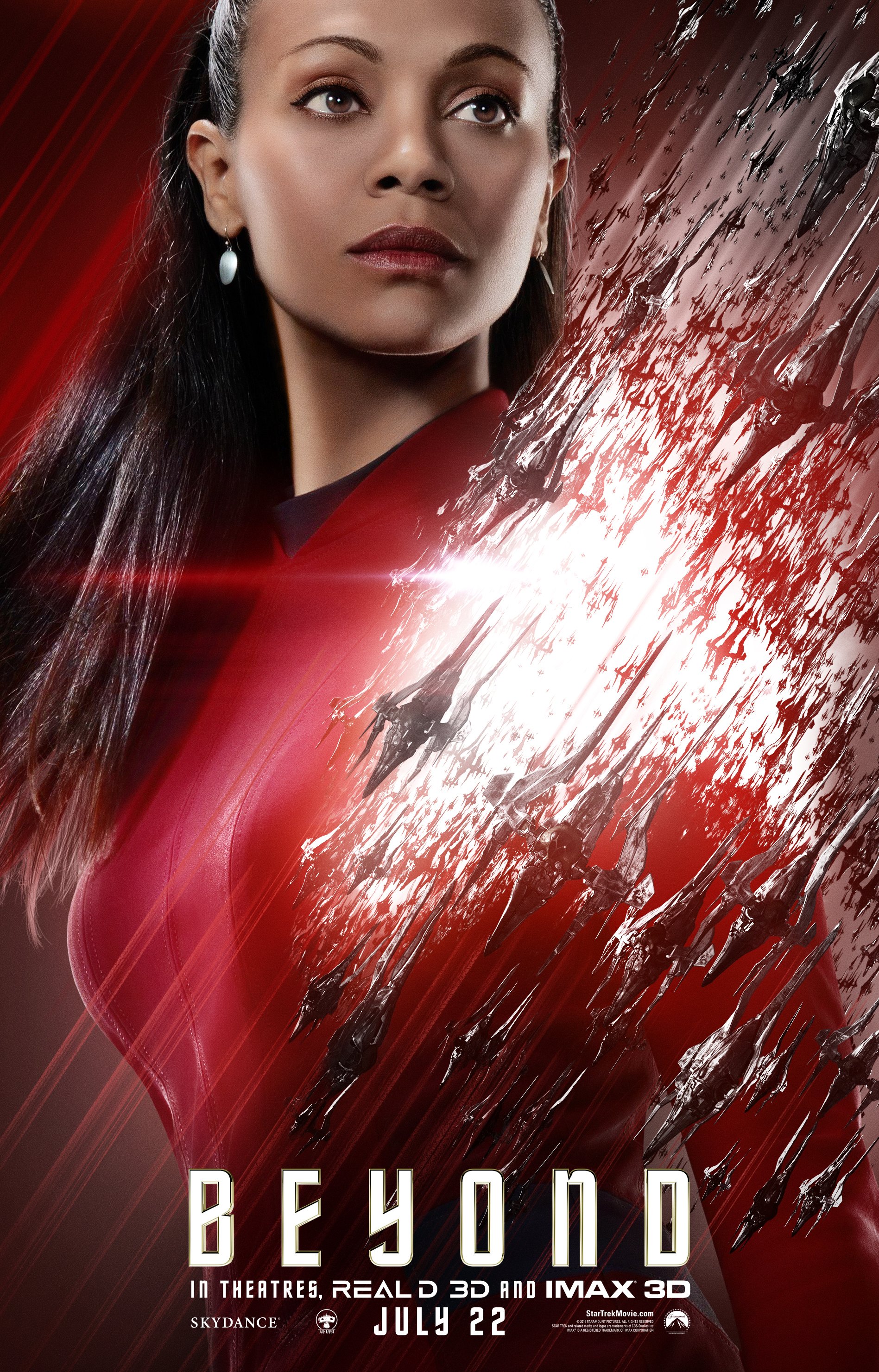 Movie poster for Star Trek Beyond: a female Starfleet officer in a red uniform gazes upward as a jagged, glowing rift tears through a metallic red background; Beyond title at bottom.