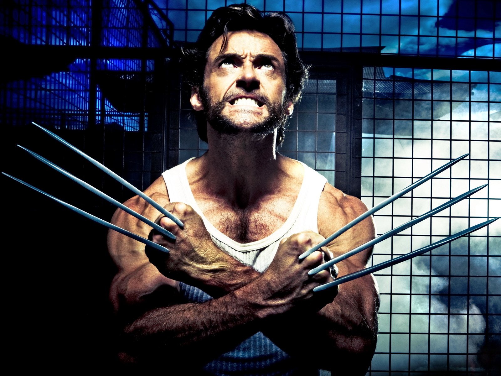 Logan James Howlett as Wolverine in a tense moment from the movie X-Men Origins: Wolverine, showcasing his iconic extended adamantium claws.