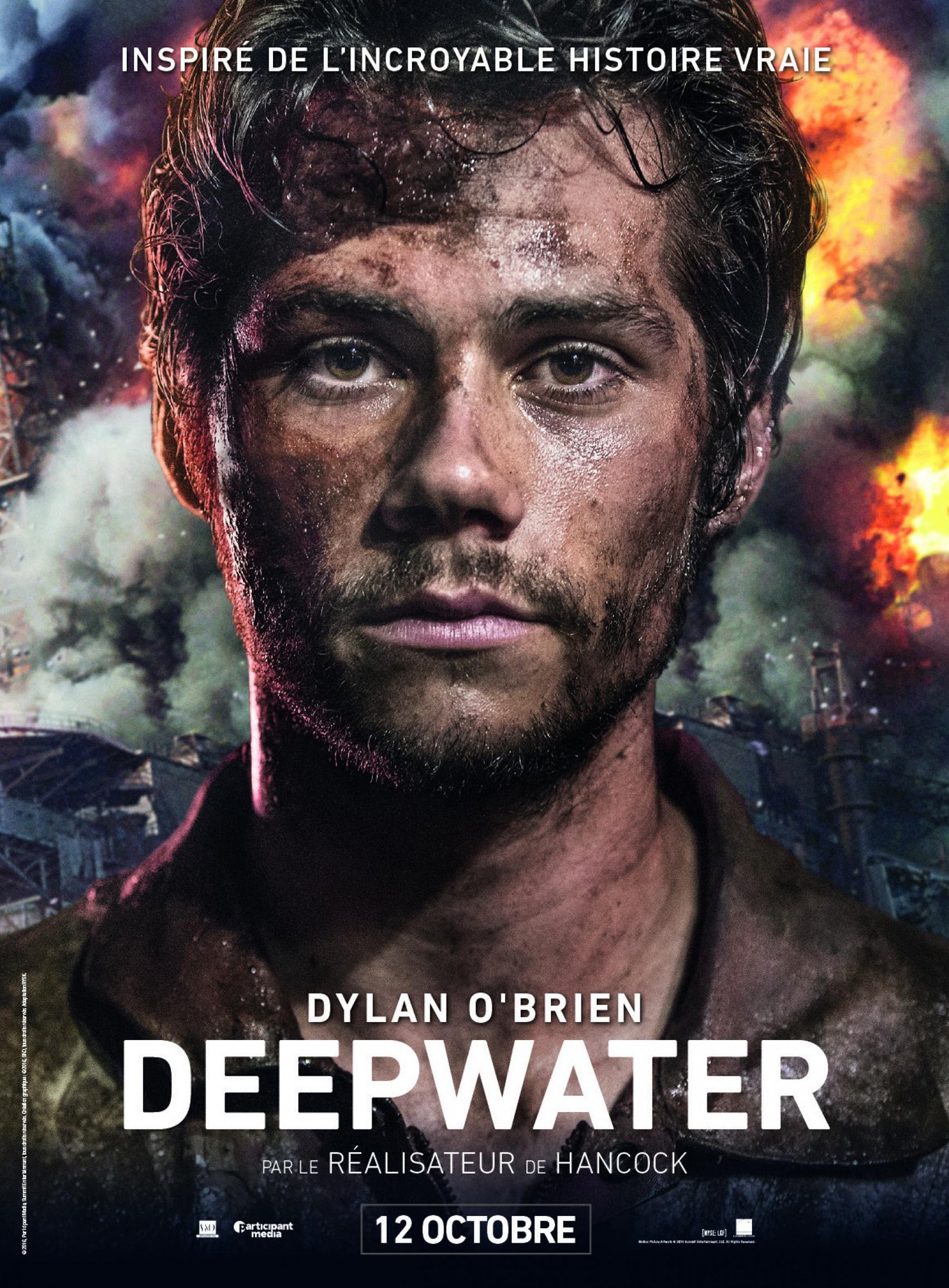 Close-up of a dirt-covered man with intense expression in front of flames and smoke, movie poster for Deep Water Horizon starring Dylan O'Brien, referencing a true story.