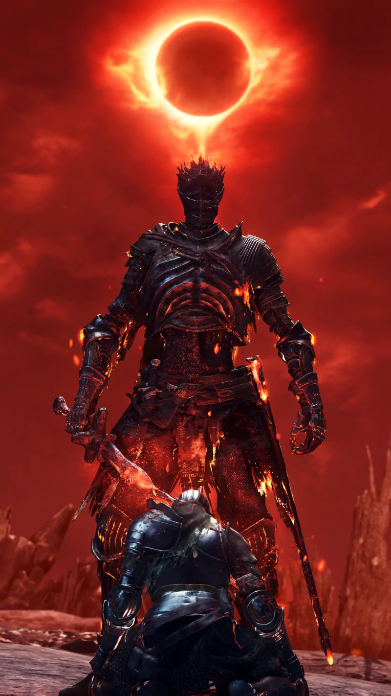 A dark armored knight stands over a kneeling warrior beneath a fiery red sky with a glowing solar eclipse in the video game Dark Souls III.